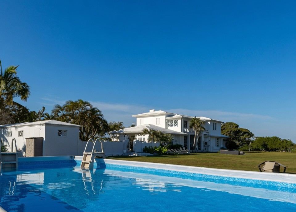 Large private pool with the Thompson Island main house in the background