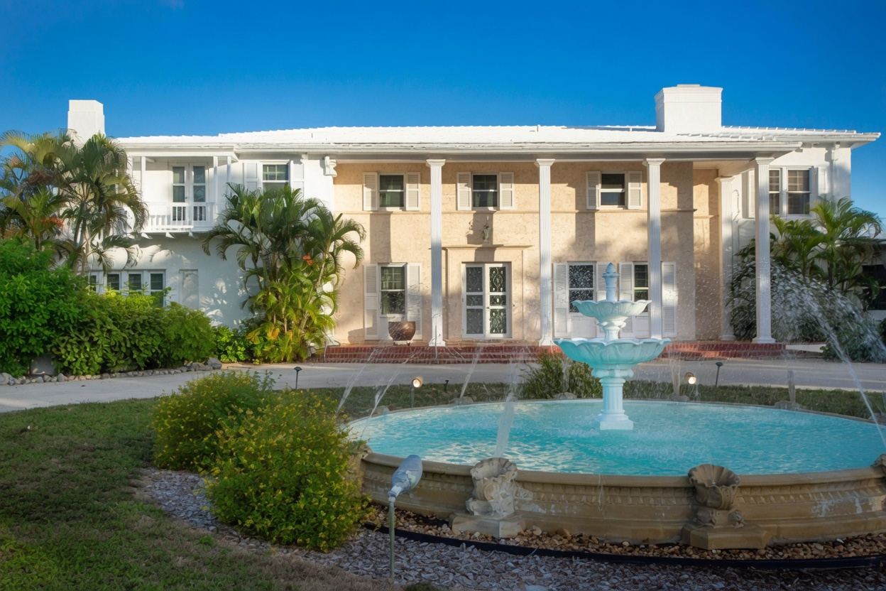 Front facade of the historic Thompson Island estate with tiered fountain
